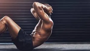 Athlete holding a low plank position on mat